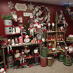 Christmas decorations and gifts arranged on shelves and wall at Evergreen Boutique & Christmas Shop