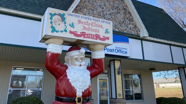 Statue of Santa stands outside the Santa Claus Post Office
